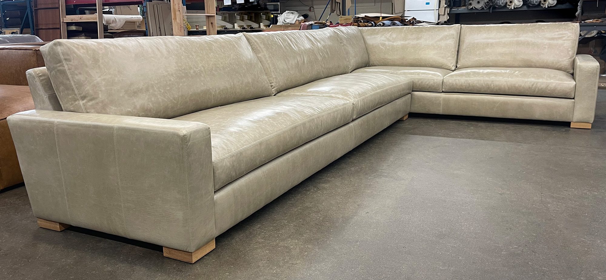 Braxton LAF L Sectional in Mont Blanc Smoke leather with Custom White Oak legs - LAF front angle view