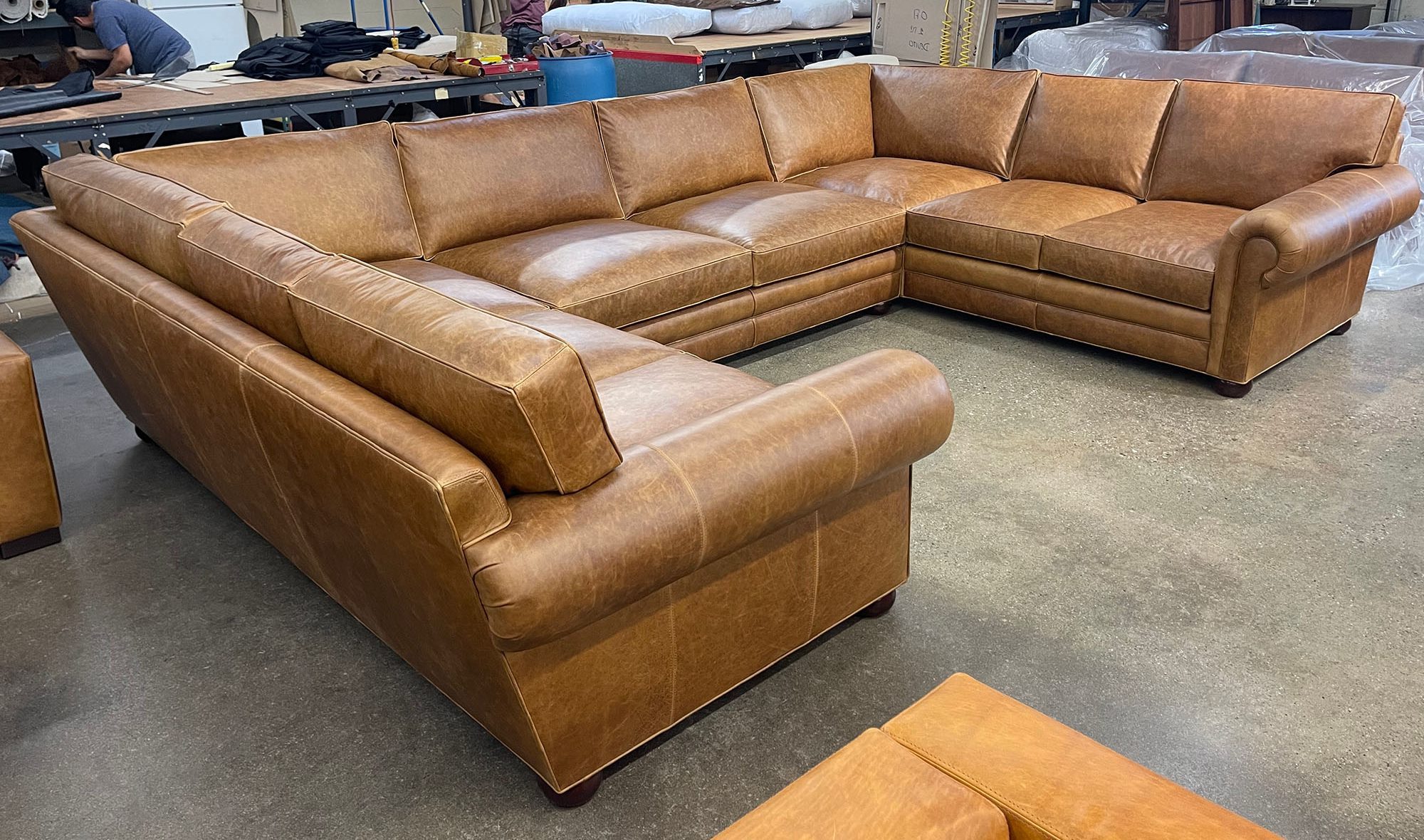 Langston U Sectional Sofa in Berkshire Chestnut leather - Size Option 2 - 48 inch depth - LAF front angle